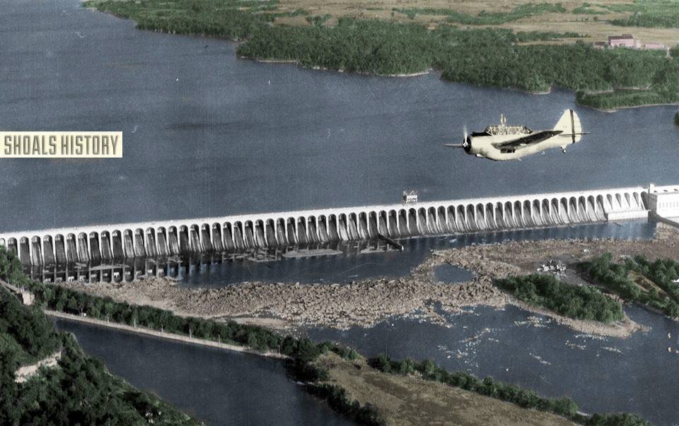 Wilson Dam aerial view with airplane